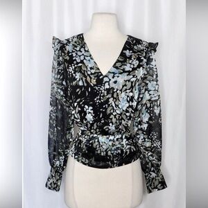 Beautiful feminine blouse, sheer sleeves, fitted waist. Excellent condition.